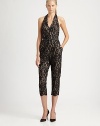 Delicate lace offers a ladylike take on the classic jumpsuit, finished with a chic halter neckline and belted waist.Halter necklineTop-fit bodiceBelted waistAnkle zippersCenter back zipperAbout 50 from shoulder to hem59% nylon/41% cottonDry cleanImportedModel shown is 5'11 (180cm) wearing US size 4.