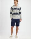 Strategic stripes add snap to this soft, slub-knit cotton sweatshirt, destined to become your favorite weekend topper.Drawstring hoodPullover stylingRaglan sleevesBanded cuffs and hemCottonMachine washImported