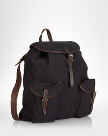 Taking a cue from vintage hiking bags, a rugged canvas backpack is accented with leather trim and multiple pockets for stylish stowing. Taking a cue from vintage hiking bags, a rugged canvas backpack is accented with leather trim and multiple pockets for stylish stowing.