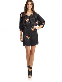 THE LOOKHummingbird print Pullover styleV-neckMock front buttonsThree-quarter length sleeves with elastic ruffled cuffs Ruffled shoulders and yokeGathered banded waist with elastic backTHE FITAbout 33 from shoulder to hemTHE MATERIALViscoseCARE & ORIGINDry cleanMade in USAModel shown is 5'10 (177cm) wearing US size Small. THE LOOKHummingbird print Pullover styleV-neckMock front buttonsThree-quarter length sleeves with elastic ruffled cuffs Ruffled shoulders and yokeGathered banded waist with elastic backTHE FITAbout 33 from shoulder to hemTHE MATERIALViscoseCARE & ORIGINDry cleanMade in USAModel shown is 5'10 (177cm) wearing US size Small.