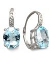 Need a color pick me up? These sparkling blue topaz earrings (7 ct. t.w.) by Victoria Townsend are the perfect pair to infuse your wardrobe. Crafted in sterling silver with sparkling diamond accents. Approximate drop: 3/4 inch.