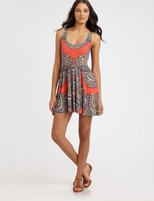 A swim coverup featuring a fitted bodice with a waist-enhancing printed detail and a flirty full skirt. Round neckSleevelessElasticized waistlinePull-on style95% modal/5% spandexMachine washMade in USA of imported fabric A swim coverup featuring a fitted bodice with a waist-enhancing printed detail and a flirty full skirt. Round neckSleevelessElasticized waistlinePull-on style95% modal/5% spandexMachine washMade in USA of imported fabric