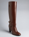 Riding boot style is taken up a notch in these elegant, equestrian-influenced boots. Elongated shafts are grounded with polished ankle wrap details.