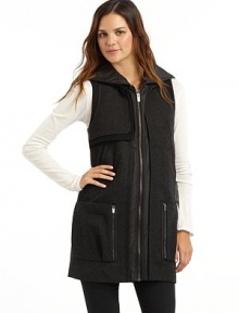 THE LOOKQuilted hoodWool blend stand collarSleevelessSingle gun flapZip frontDual welt & zip pocketsTonal pipingBack button tab detailTHE FITAbout 30½ from shoulder to hemTHE MATERIAL43% wool/30% rayon/27% polyesterTrim & fill: polyesterFully linedCARE & ORIGINDry cleanImported THE LOOKQuilted hoodWool blend stand collarSleevelessSingle gun flapZip frontDual welt & zip pocketsTonal pipingBack button tab detailTHE FITAbout 30½ from shoulder to hemTHE MATERIAL43% wool/30% rayon/27% polyesterTrim & fill: polyesterFully linedCARE & ORIGINDry cleanImported