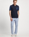 Soft and simple, with an unexpected sleeve and chest pocket detail.Three-buttonCottonMachine washImported