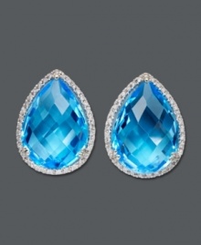 Splash yourself in crystal blue hues. These sparkling stud earrings are crafted from pear-cut blue topaz (22-3/4 ct. t.w.) and round-cut diamonds (1/3 ct. t.w.) set in 14k white gold. Approximate diameter: 3/4 inch x 1/2 inch.