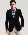 A wardrobe staple from Salvatore Ferragamo, the velvet blazer brings warmth to your casual look.