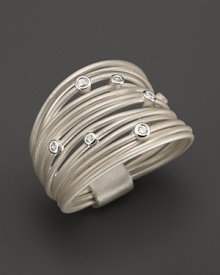 Brilliant diamonds accent bands of sterling silver in this ring from India Hicks.