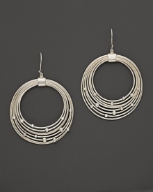 Brilliant diamonds accent concentric sterling silver circles in India Hicks' Tread hoop earrings. Brilliant diamonds accent concentric sterling silver circles in India Hicks' Tread hoop earrings.