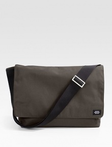 A handsome carry-all for the classroom and the office alike, perfect for your laptop in rugged nylon canvas. Flap Velcro® closure Headphone audio port Front zip pockets Back slip pocket Interior zip and organizing pockets Laptop envelope Adjustable shoulder straps 18W X 11½H X 5½D Imported A handsome carry-all for the classroom and the office alike, perfect for your laptop in rugged nylon canvas. Flap Velcro® closure Headphone audio port Front zip pockets Back slip pocket Interior zip and organizing pockets Laptop envelope Adjustable shoulder straps 18W X 11½H X 5½D Imported