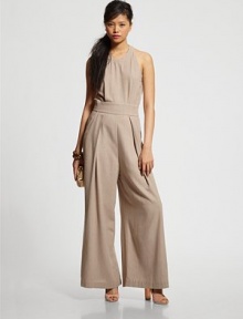 Revitalize your after-hours wardrobe with this timeless silk jumpsuit, characterized by front pleating, wide-leg construction and an open back. CrewneckSleevelessBanded waistBack button closure at neckOpen backZipper at lower backBack besom pocketsFully linedInseam, 36SilkDry cleanMade in USAModel shown is 5'9 (175cm) wearing US size 4. Revitalize your after-hours wardrobe with this timeless silk jumpsuit, characterized by front pleating, wide-leg construction and an open back. CrewneckSleevelessBanded waistBack button closure at neckOpen backZipper at lower backBack besom pocketsFully linedInseam, 36SilkDry cleanMade in USAModel shown is 5'9 (175cm) wearing US size 4.