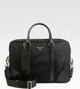 A simple, structured briefcase for all of your work-day essentials in tessuto nylon with saffiano leather trim.Zip closureDouble top handlesAdjustable shoulder strapInterior pocketID tagNylon16W x 11H x 5DMade in Italy