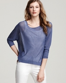 This Eileen Fisher top is crafted in an airy open knit with a metallic finish for subtle glamorous edge. This Eileen Fisher top is crafted in an airy open knit with a metallic finish for subtle glamorous edge.