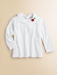 A delicate picot trim and floral appliqué adds charm to this versatile knit top.Peter pan collarLong sleevesBack zipperRuffled hemCottonMachine washImported