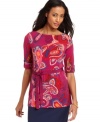 A pretty paisley print and a dainty ribbon belt create a charming effect on this petite tunic from Charter Club.