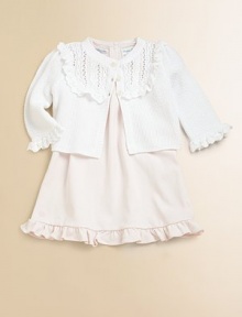 A dainty ruffled shrug is knit from luxurious pima cotton with pretty pearlized buttons for a warm, cozy fit for baby.V-neckLong sleevesButton downDelicate ruffles accent the bib and cuffsPima cottonHand washImported Please note: Number of buttons/snaps may vary depending on size ordered. A dainty ruffled shrug is knit from luxurious pima cotton with pretty pearlized buttons for a warm, cozy fit for baby.V-neckLong sleevesButton downDelicate ruffles accent the bib and cuffsPima cottonHand washImported Please note: Number of buttons/snaps may vary depending on size ordered.
