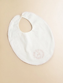 A soft cotton twill bib is finished with sweet floral embroidery and a scalloped trim.ScoopneckSingle button closureCottonMachine washImported