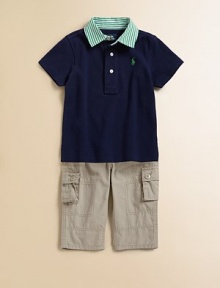 A classic cotton mesh polo gets a contemporary update with a striped woven collar, blending the polished appeal of a dress shirt with the breathable comfort of a polo for timeless iconic style.Striped polo collarShort sleeves with sewn armbandsFront buttonsEven vented hemCottonMachine washImported A classic cotton mesh polo gets a contemporary update with a striped woven collar, blending the polished appeal of a dress shirt with the breathable comfort of a polo for timeless iconic style.Striped polo collarShort sleeves with sewn armbandsFront buttonsEven vented hemCottonMachine washImported