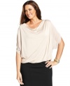 Elegant draping beautifully highlights Alfani's dolman sleeve plus size top, finished by a bubble hem.