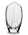 This elegant vase is small and striking and takes its shape from the inspiring look of a flower bud. In substantial, carefully crafted handmade crystal from Baccarat, with subtle curving waves of thickness along the sides and a mouth that comes to two gentle points, this vase is simply exquisite.