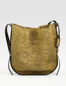 Intricately woven raffia in a roomy carryall finished with rich leather trim.Leather shoulder strap, 20 dropTop snap closure18W X 15¾H X 1DImported Intricately woven raffia in a roomy carryall finished with rich leather trim.Leather shoulder strap, 20 dropTop snap closure18W X 15¾H X 1DImported