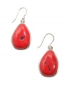 Let smooth, earthy pebbles adorn your earlobes. Bright coral-colored reconstituted calcite stones dangle daintily from a silver tone mixed metal setting and french wire backing. Approximate drop: 1-1/2 inches.