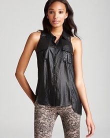 Exposed zips at the shoulders lend edge to this GUESS top, articulated in a sleeveless silhouette with button front and flap pockets. Exposed zips at the shoulders lend edge to this GUESS top, articulated in a sleeveless silhouette with button front and flap pockets.