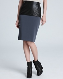 This Jean Paul Gaultier puts a forward spin on a classic look adding a sleek leather panel to a stretch pencil skirt for the ultimate example of day-to-night style. This Jean Paul Gaultier puts a forward spin on a classic look adding a sleek leather panel to a stretch pencil skirt for the ultimate example of day-to-night style.