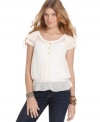 All about delicate style, this top from American Rag fuses sweet accents with an ever-so-slight blouson fit.