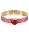 Pucker up. This bangle bracelet from Betsey Johnson is crafted from antique gold-tone mixed metal with fuchsia glass crystal accents, sealing everything with a kiss. Approximate diameter: 2-1/4 inches.