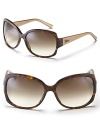 Dior's oversized two-tone sunglasses offer haute couture style in a simple design. Nose tabs help to secure fit.