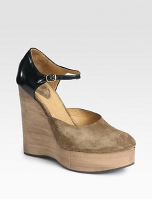 Suede and patent leather combine in this two-tone Mary Jane staple with a stacked wooden wedge. Stacked wedge, 5 (125mm)Stacked platform, 1 (25mm)Compares to a 4 heel (100mm)Suede and patent leather upperAdjustable ankle strapLeather liningRubber solePadded insoleMade in ItalyOUR FIT MODEL RECOMMENDS ordering one size up as this style runs small. 
