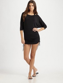 A flattering coverup with side ties for a customizable fit.Round neckThree-quarter sleevesSide tiesCord ends92% polyester/8% spandexHand washImported A flattering coverup with side ties for a customizable fit.Round neckThree-quarter sleevesSide tiesCord ends92% polyester/8% spandexHand washImported