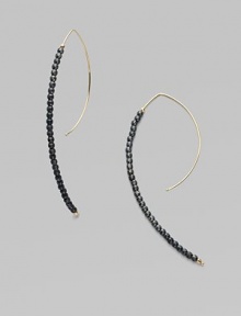 A striking modernist shape strung with oxidized sterling silver beads capped with 14k yellow gold beads.14k yellow gold Oxidized sterling silver Length, about 2¾ Pierced Made in USA A striking modernist shape strung with oxidized sterling silver beads capped with 14k yellow gold beads.14k yellow gold Oxidized sterling silver Length, about 2¾ Pierced Made in USA