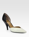 Opposites attract in this two-tone cutout silhouette of smooth leather with an elegant point toe. Stacked heel, 3¾ (95mm)Leather upperPoint toeLeather lining and solePadded insoleImported