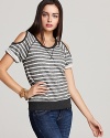 Bold stripes and cutout shoulders add serious edge to this ALTERNATIVE sweatshirt.