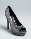 Vera Wang Lavender Label offers a perfect take on the peep toe evening pump style, in luxurious, glittering fabric that will work with denim or dresses.