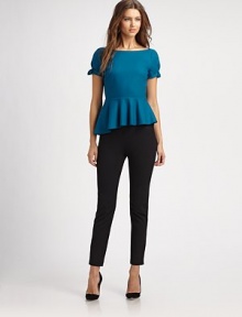 Featuring a fascinating take on one of this season's hottest trends, this top has an asymmetrical peplum waist that will stand out among the rest.BoatneckShort sleevesAsymmetrical peplum hemAbout 22 from shoulder to hem80% wool/17% nylon/3% elastaneDry cleanImported Model shown is 5'11 (180cm) wearing US size Small. 