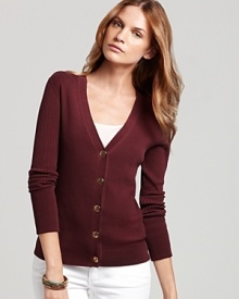 The search for the perfect cardigan is over, thanks to this Tory Burch ribbed cotton sweater in a just-right fit with a v neckline and golden logo buttons at the front. The search for the perfect cardigan is over, thanks to this Tory Burch ribbed cotton sweater in a just-right fit with a v neckline and golden logo buttons at the front.