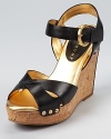 Jet black leather makes a bold appearance against a cork wedge on the standout Halina sandal from IVANKA TRUMP.