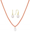 Casual chic. This pendant and earrings set from Majorica pops with organic man-made pearls (9 mm). The orange cord necklace adds a touch of whimsy. Crafted in gold tone mixed metal. Approximate length: 16 to 18 inches. Approximate drop: 1/2 inch.