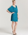 Covered in light-catching sequins, this sparkling Aidan Mattox dress features cutout shoulders for added allure.