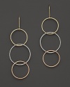 Interlocking tri-color hoop earrings in 14K gold evoke bohemian elegance. From Lana.