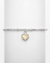 Heart-shaped canary crystal stone on a textured sterling silver linen bangle. Designed by Judith Ripka.