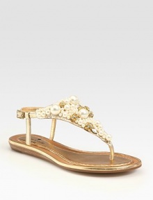 Glitzy rhinestones and precious pearl-like embellishments make this metallic leather flat an absolute must. Metallic leather upperRhinestone and pearl-like embellishmentsLeather lining and solePadded insoleImported