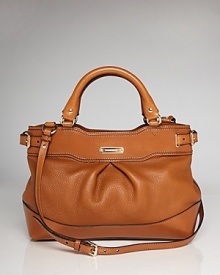 True to form, this Burberry satchel works a classic vibe in rich leather with a versatile design that is perfect on the arm or across the body. True to form, this Burberry satchel works a classic vibe in rich leather with a versatile design that is perfect on the arm or across the body.