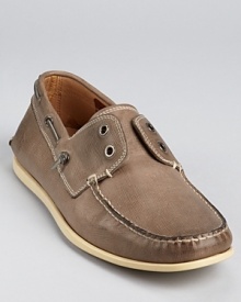 Laceless boat shoe stylings from John Varvatos Star USA, embellished with a moc toe, contrast topstitching and leather linings. Laceless boat shoe stylings from John Varvatos Star USA, embellished with a moc toe, contrast topstitching and leather linings.