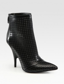 Allover perforations and an exposed back zipper amp up this ankle-grazing leather design. Self-covered heel, 2 (50mm)Leather upperExposed back zipperLeather lining and solePadded insoleImported