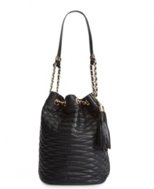 Keep your cool with a gorgeous quilted design from BCBGMAXAZRIA. This spacious bucket shape is accented with goldtone chains and a classic tassel charm. Keep your cool with a gorgeous quilted design from BCBGMAXAZRIA. This spacious bucket shape is accented with goldtone chains and a classic tassel charm.