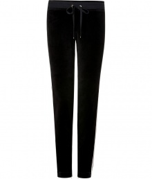 Work a modern edge into your laid-back look with Juicy Coutures jet black skinny velour pants - Drawstring elasticized waistline, tan grosgrain trim - Slim leg, figure-hugging fit - Team with oversized pullovers and chic fashion sneakers